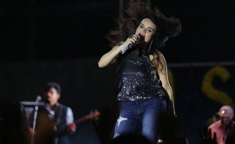 Singer performing live with a band